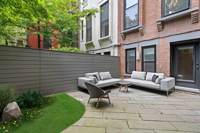 a view of a patio with couches and potted plants