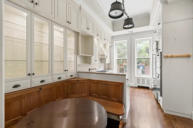 a view of a patio with couches table and chairs and potted plants