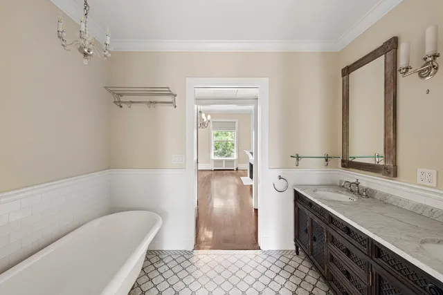 a spacious bedroom with a bed and a fireplace