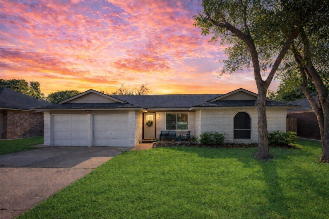 A charming 3-bedroom, 2-bath home with a white brick exterior and spacious 2-car garage, located in the desirable Huntington Village Sec 01 subdivision.