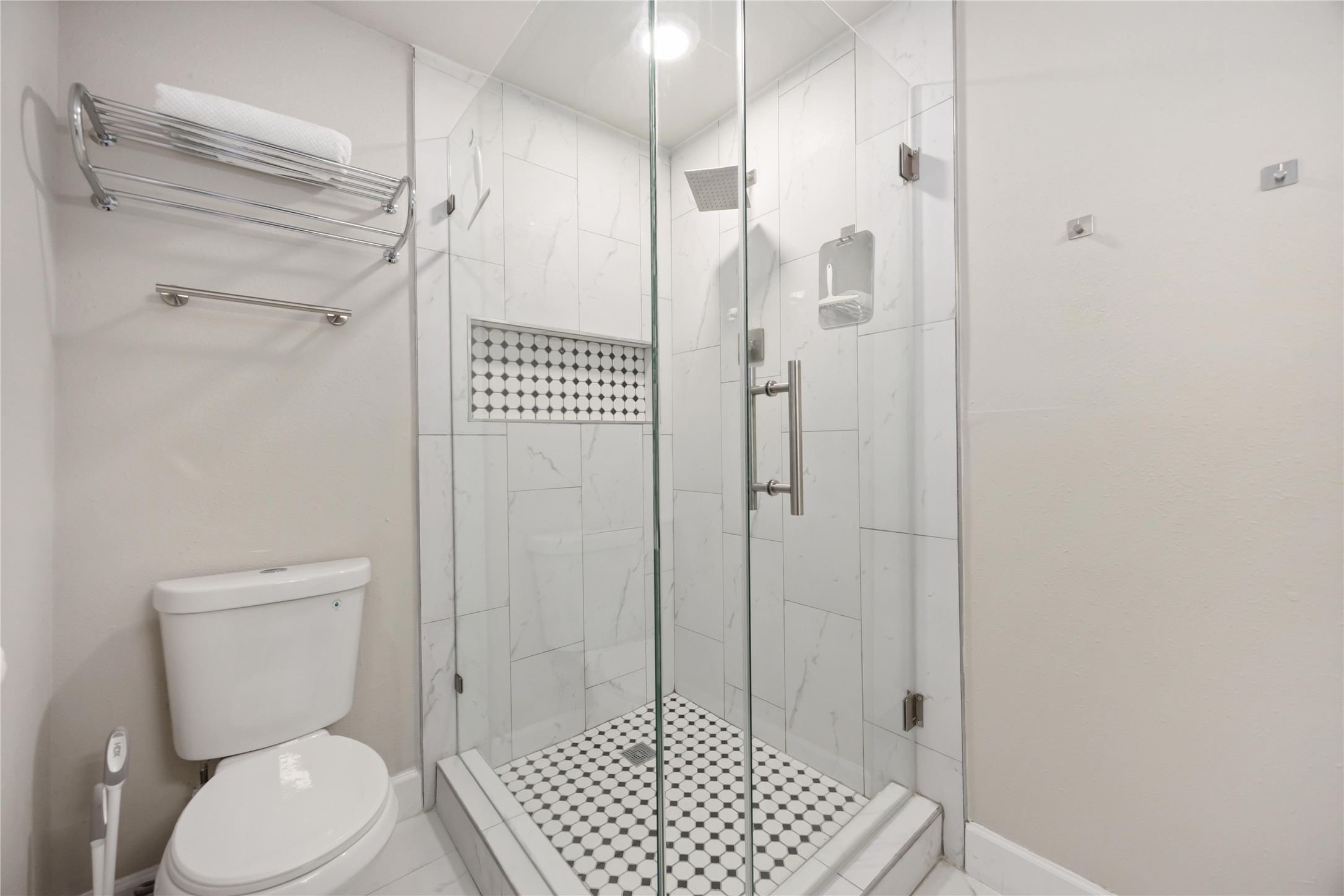 12119 Spring Grove Drive Houston, TX 77099 - Photo 17 of 30 a bathroom with a toilet and a shower