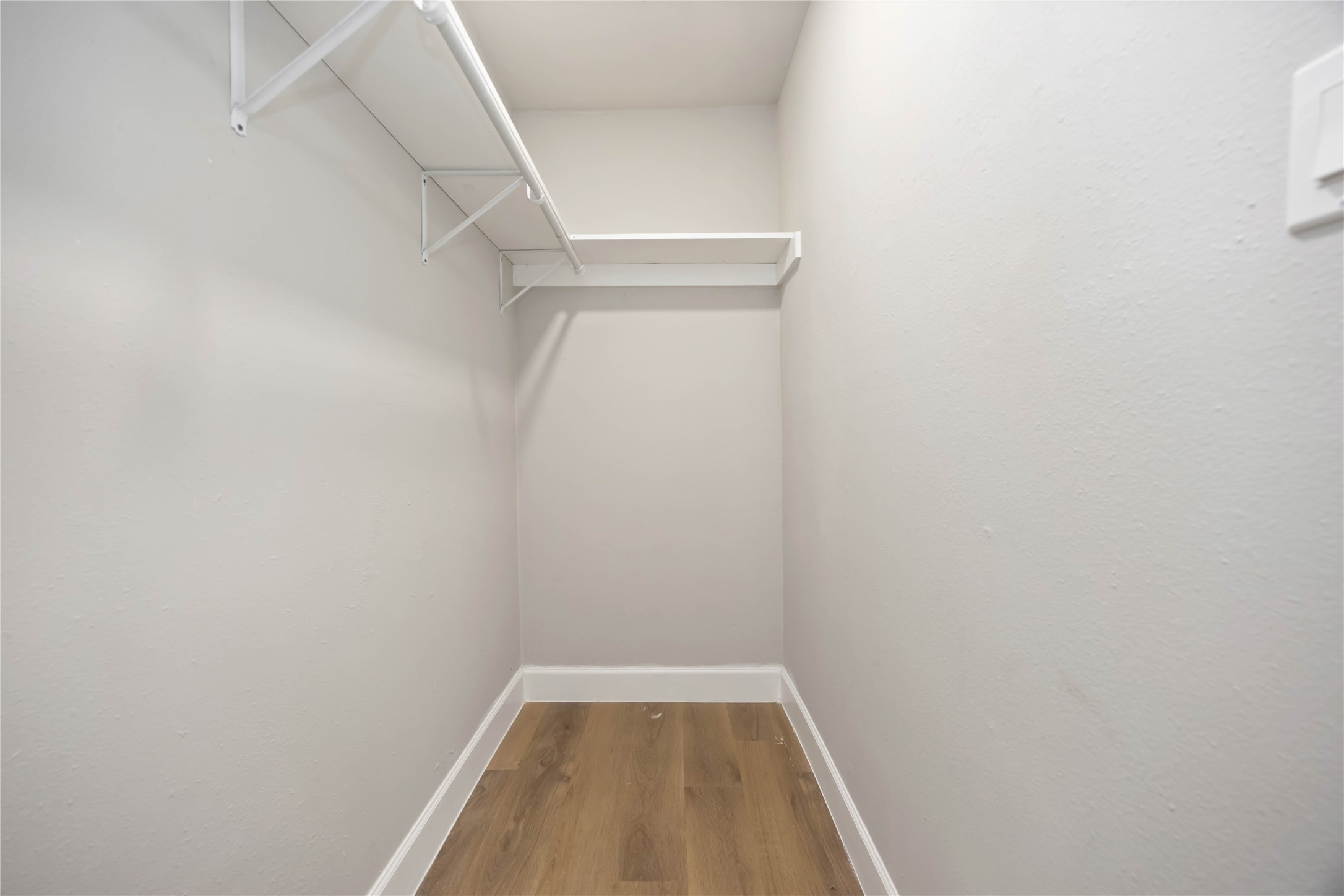 12119 Spring Grove Drive Houston, TX 77099 - Photo 21 of 30 a view of small space with racks on the wall