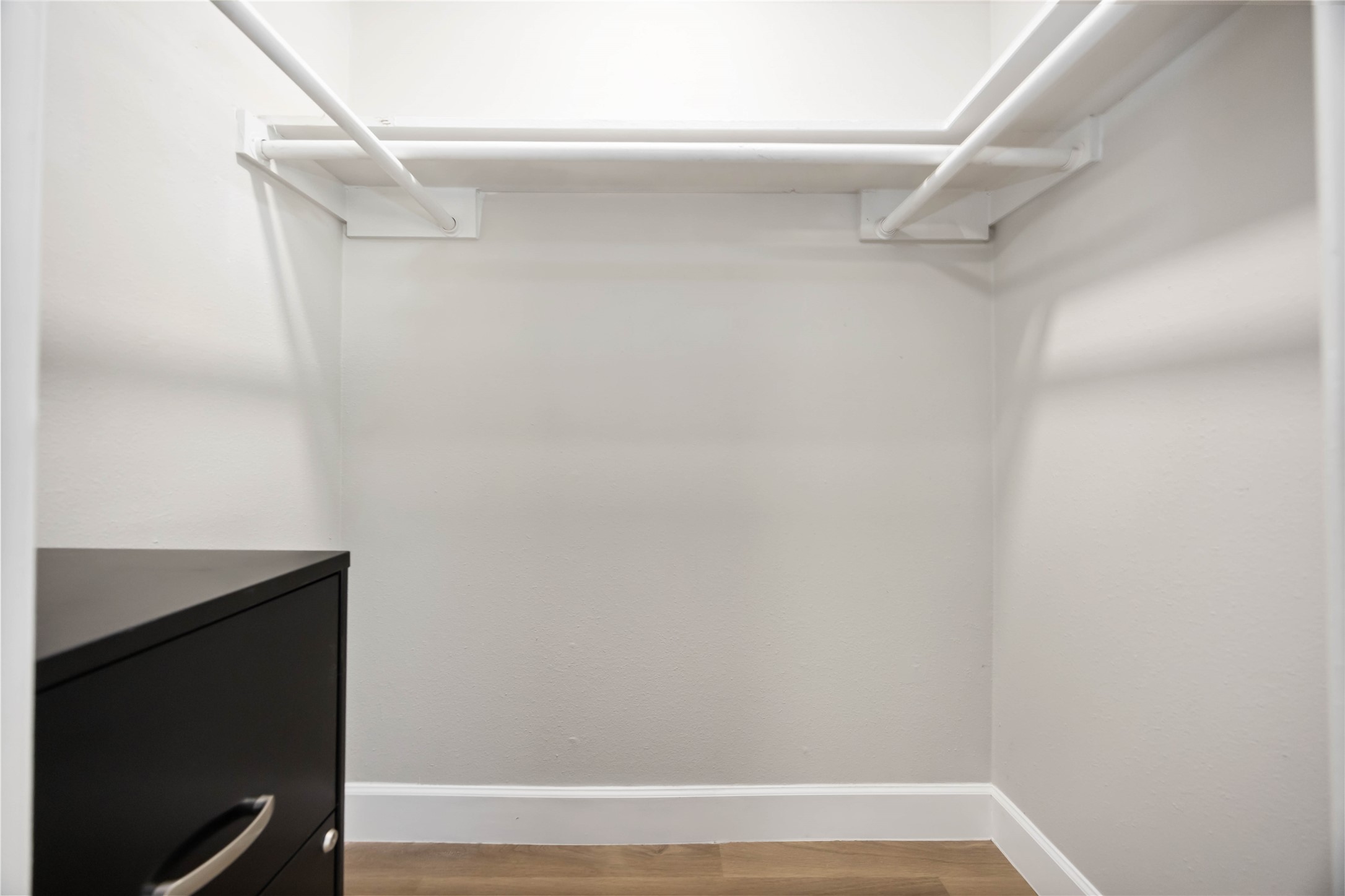 12119 Spring Grove Drive Houston, TX 77099 - Photo 23 of 30 a view of small space with racks on the wall