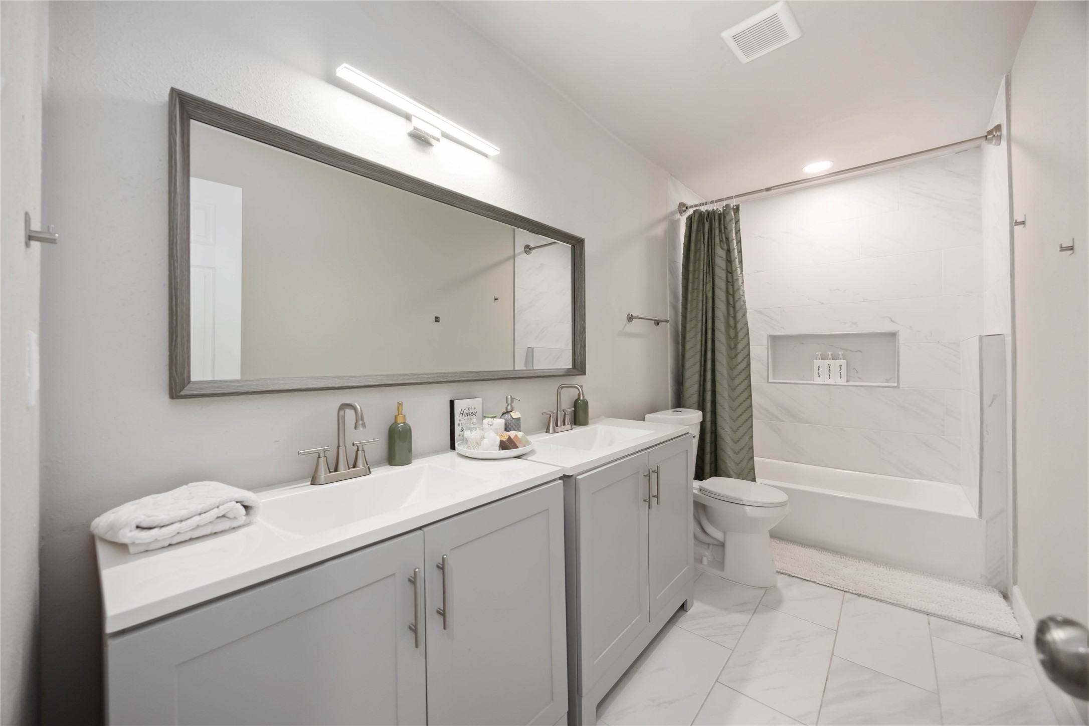 12119 Spring Grove Drive Houston, TX 77099 - Photo 24 of 30 a bathroom with a toilet sink and mirror