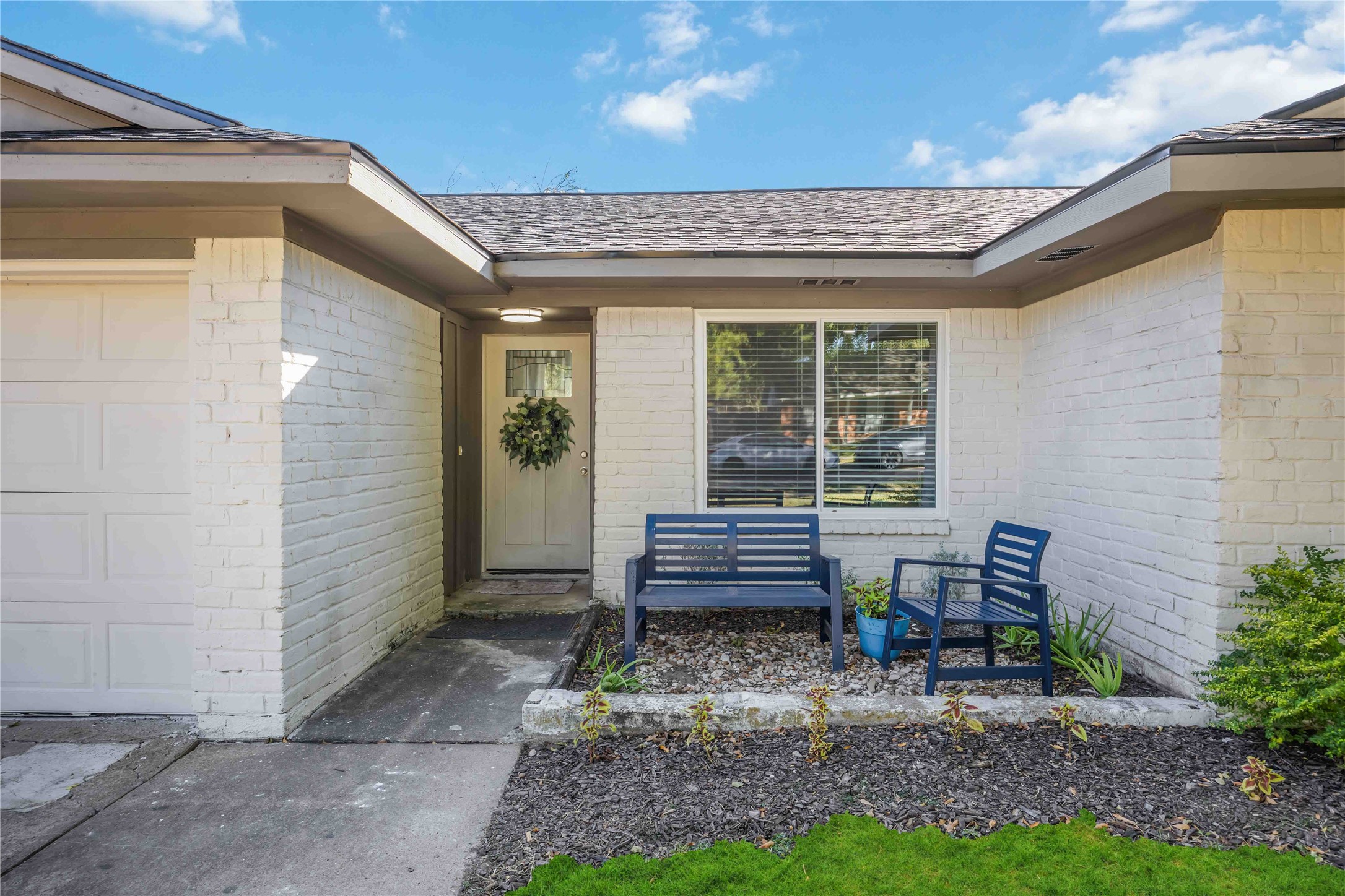 12119 Spring Grove Drive Houston, TX 77099 - Photo 3 of 30 a wooden bench sitting in front of a building