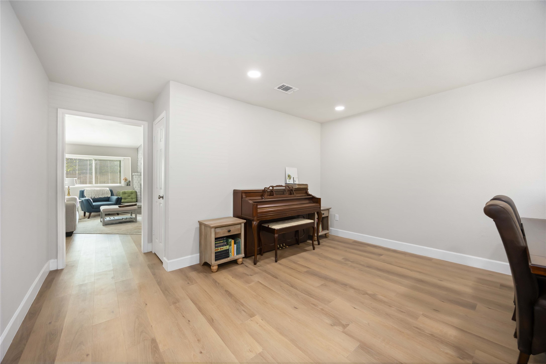 12119 Spring Grove Drive Houston, TX 77099 - Photo 4 of 30 a view of a workspace with furniture and wooden floor