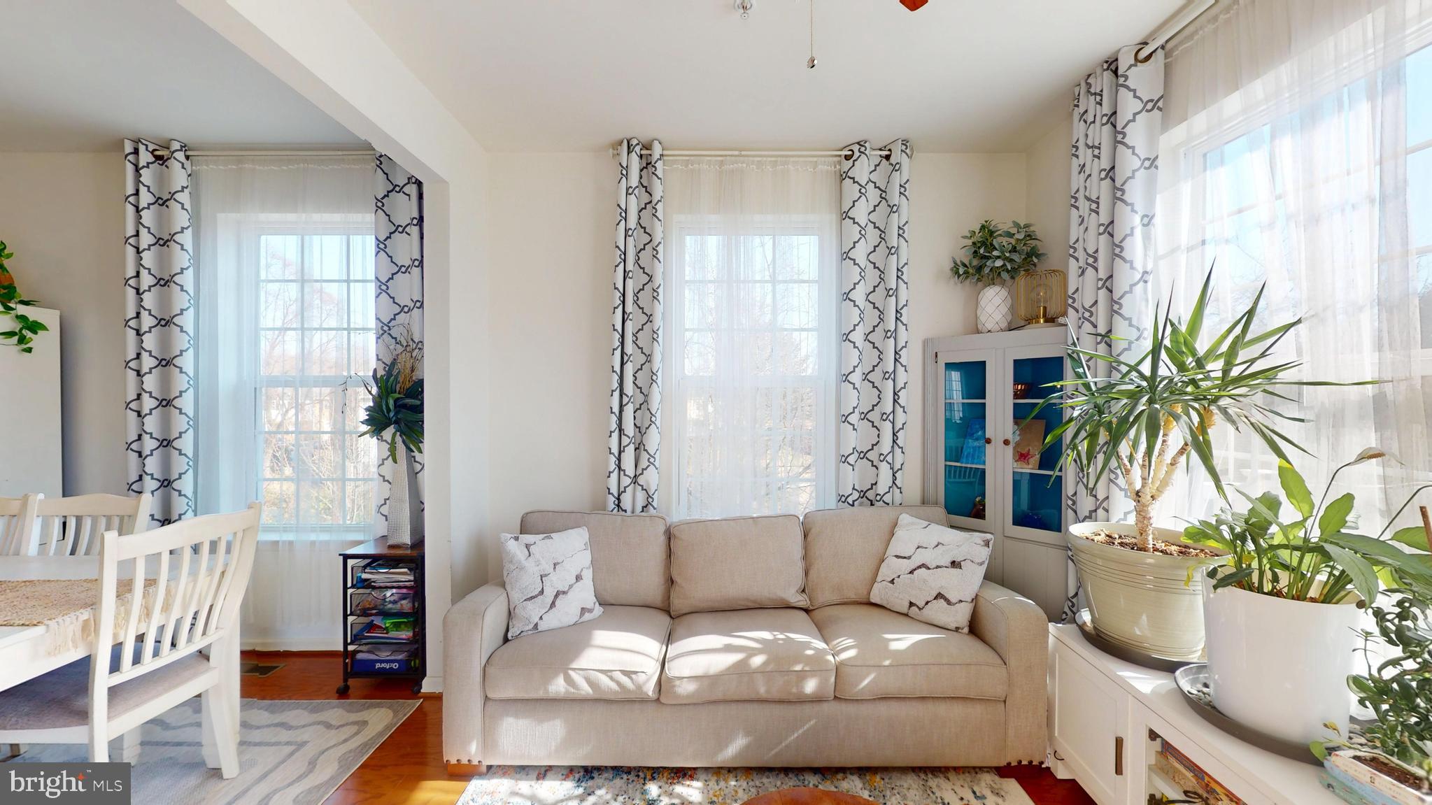 8548 Golden Eagle Lane Severn, MD 21144 - Photo 25 of 76 a living room with furniture and a potted plant