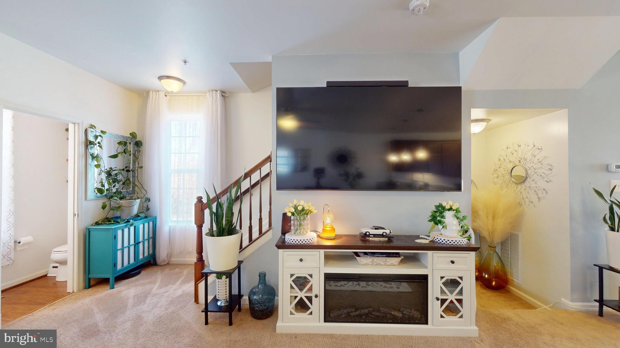 8548 Golden Eagle Lane Severn, MD 21144 - Photo 31 of 76 a living room with furniture and a fireplace