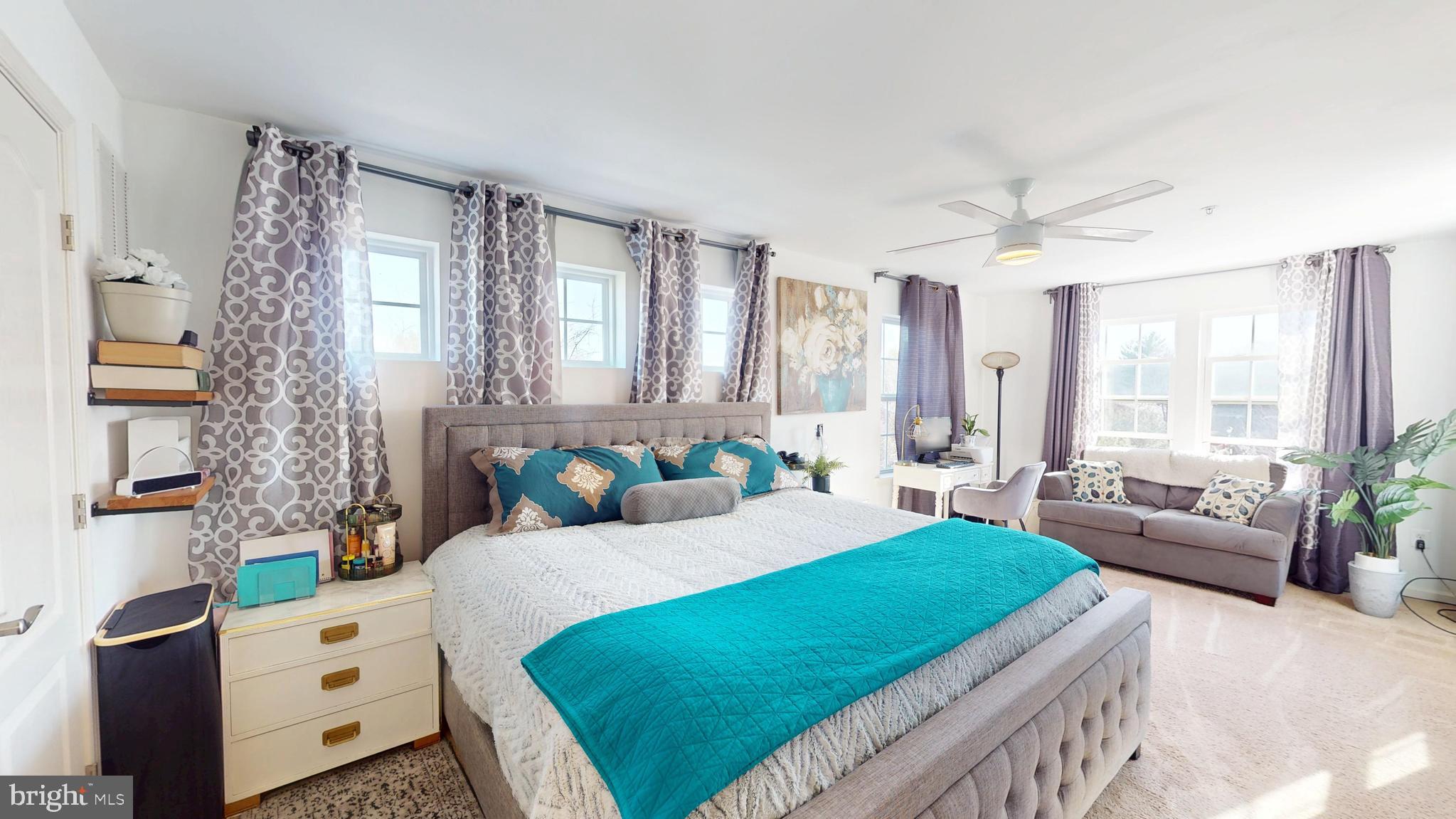 8548 Golden Eagle Lane Severn, MD 21144 - Photo 37 of 76 a bedroom with a bed couch and a window