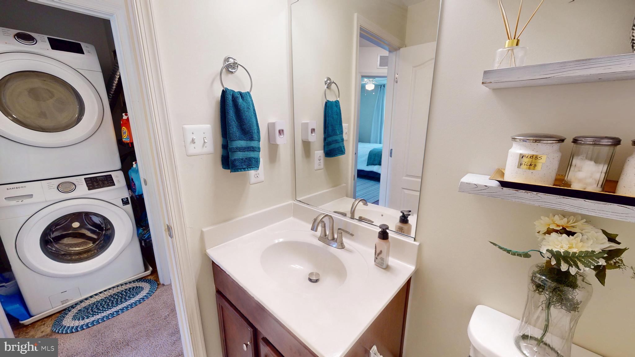 8548 Golden Eagle Lane Severn, MD 21144 - Photo 48 of 76 a bathroom with a sink and a mirror