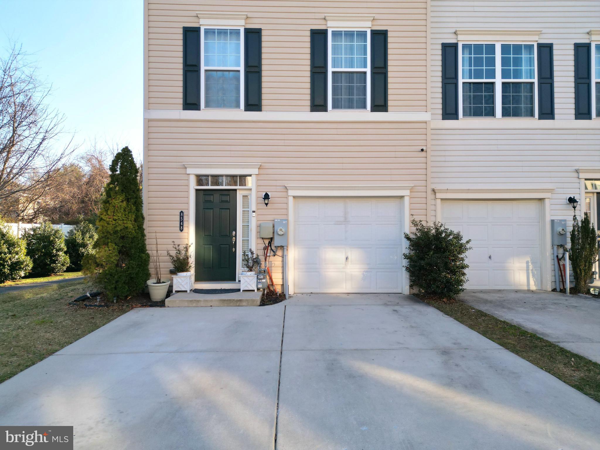 8548 Golden Eagle Lane Severn, MD 21144 - Photo 5 of 76 a view of a house with a yard and potted plants
