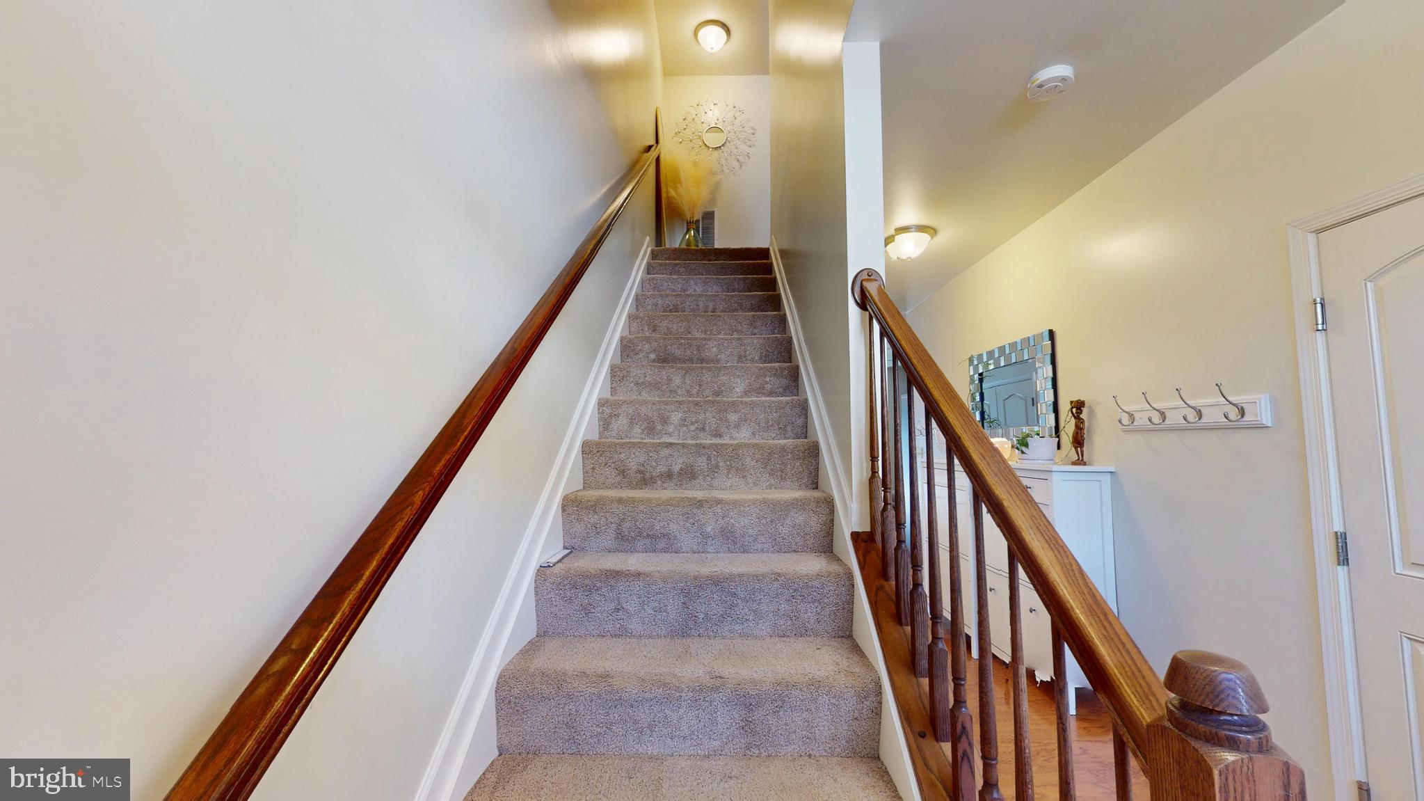 8548 Golden Eagle Lane Severn, MD 21144 - Photo 7 of 76 a view of a hallway with stairs