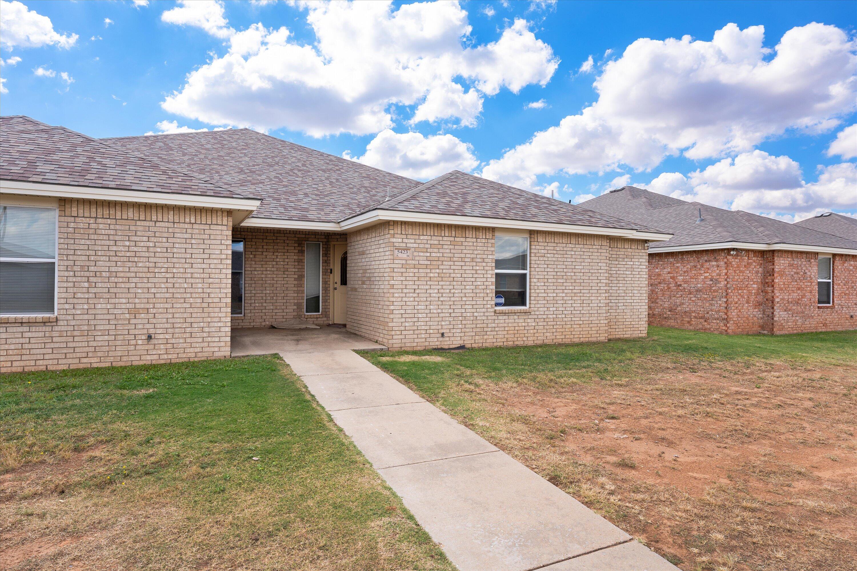5423 Marshall Street Lubbock, TX 79416 - Photo 2 of 25 a backyard of a house