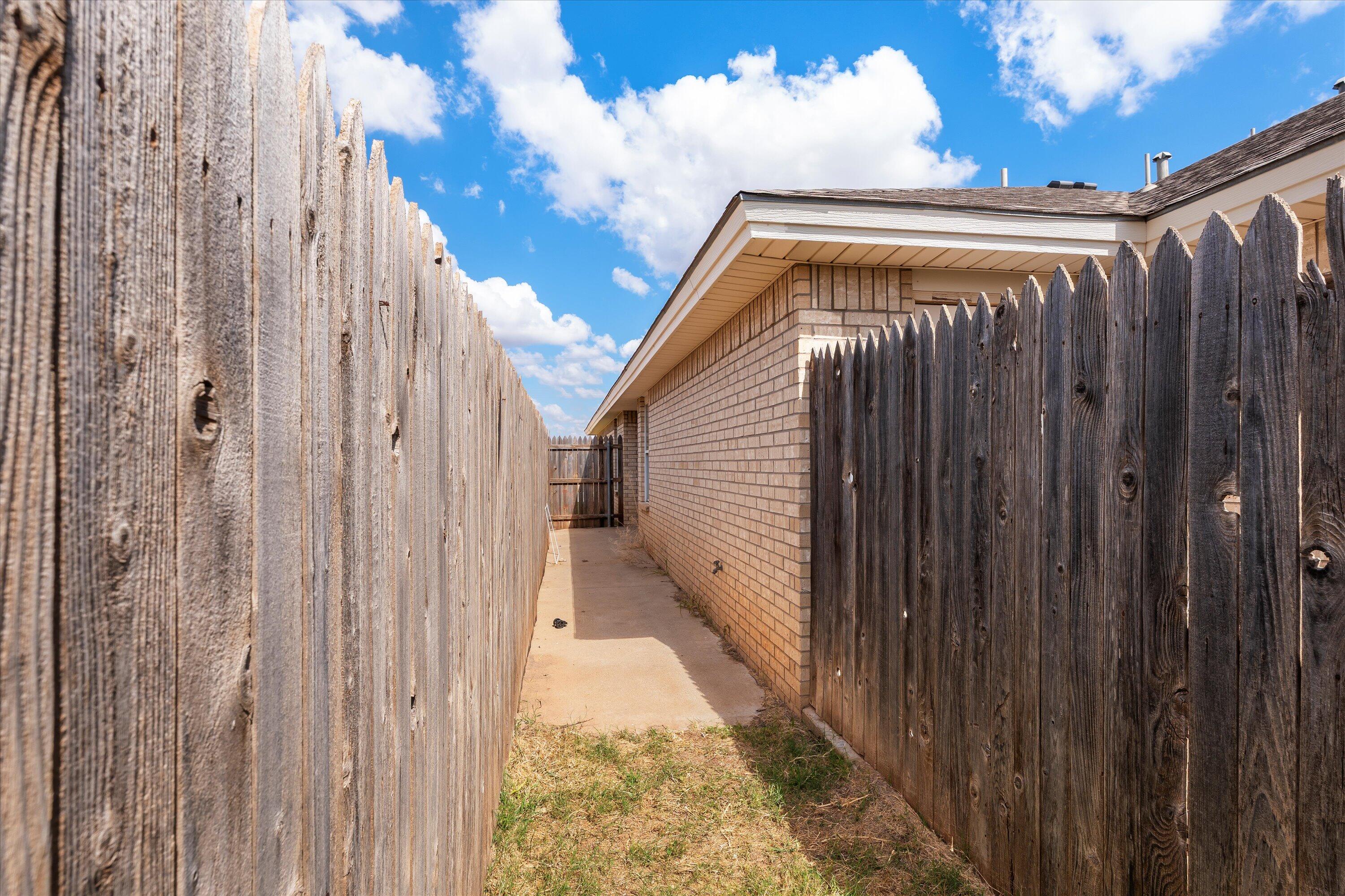 5423 Marshall Street Lubbock, TX 79416 - Photo 24 of 25 a view of a wooden door