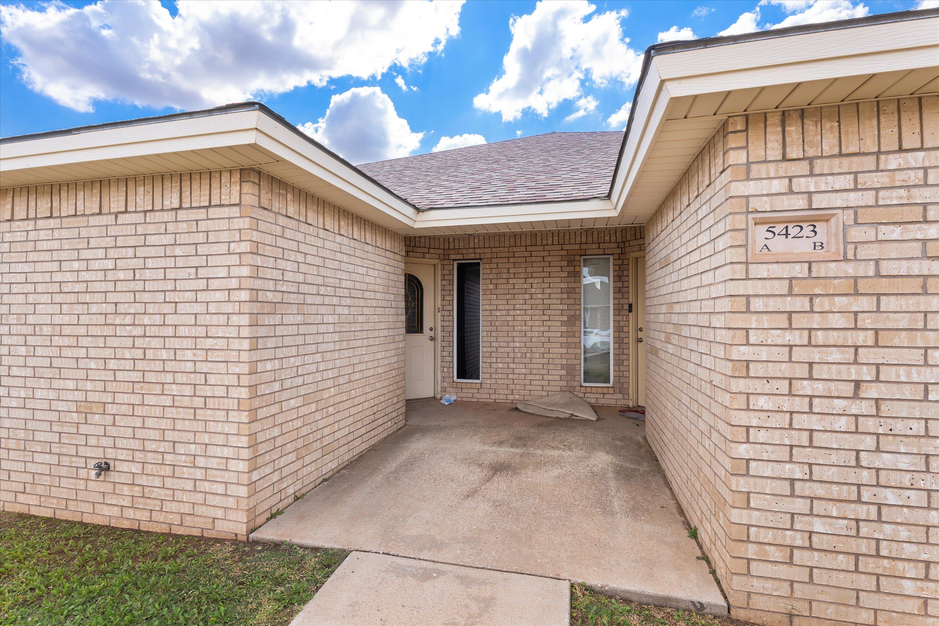 5423 Marshall Street Lubbock, TX 79416 - Photo 4 of 25 a view of a wooden door