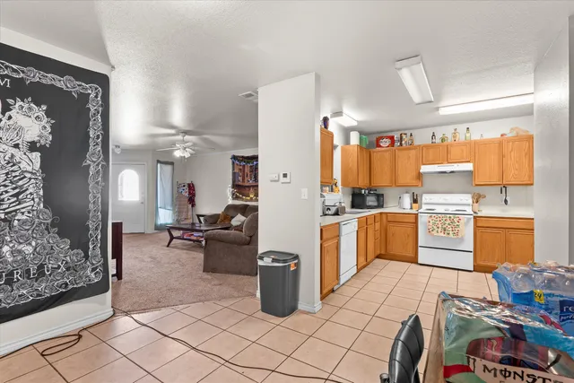 a kitchen with refrigerator and cabinets
