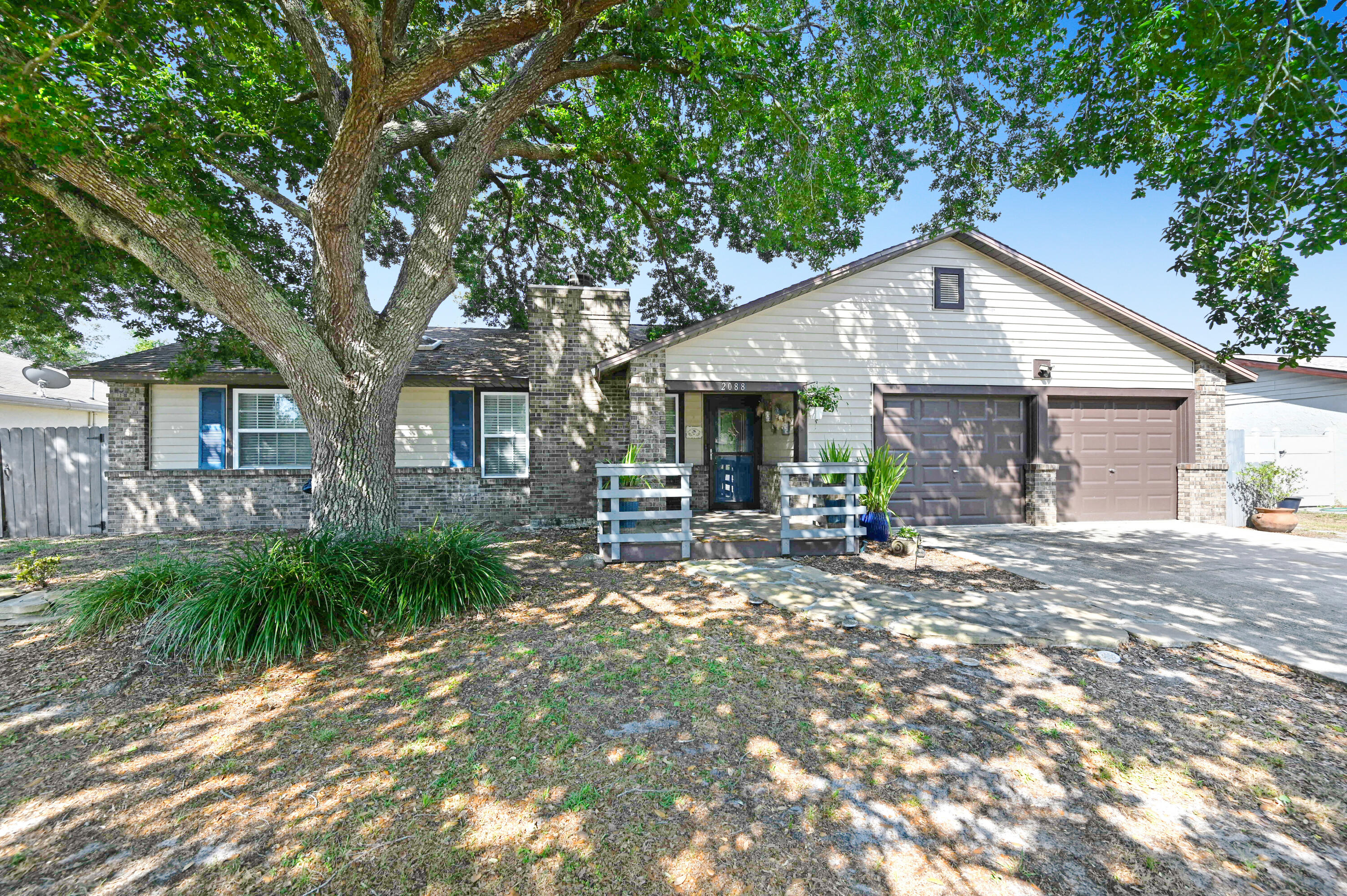 2088 Jupiter Boulevard Southwest Palm Bay, FL 32908 - Photo 1 of 54 a view of a house with backyard and garden