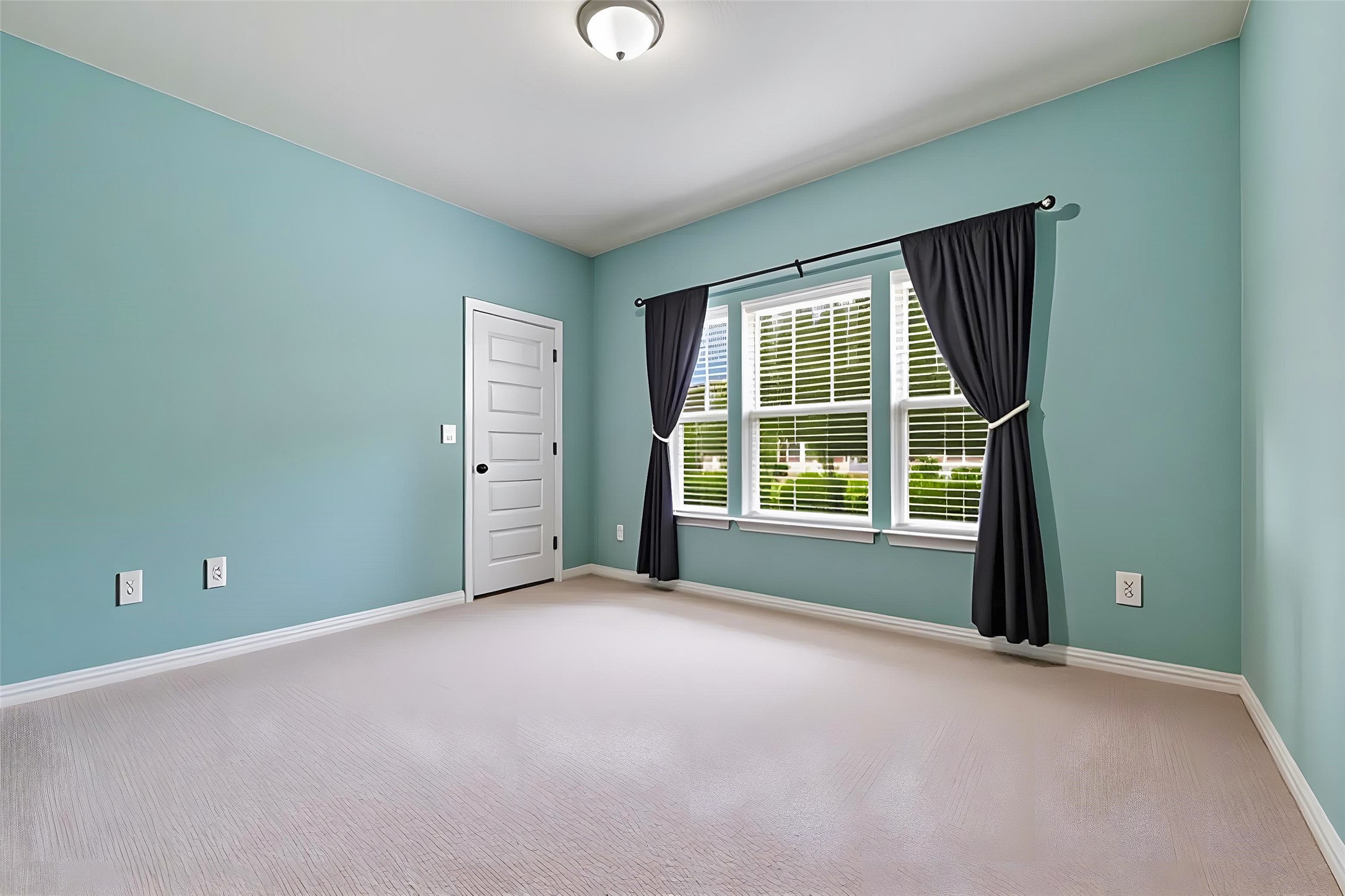 8721 Sikes Way Austin, TX 78747 - Photo 20 of 33 Bedroom #2 featuring multiple large windows, light wall color, and light-toned carpeting