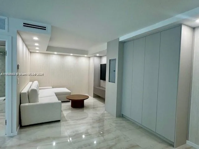 a bathroom with a tub and a glass door