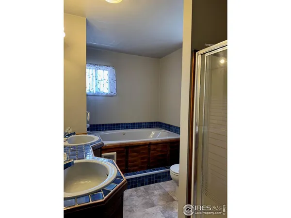 a room with a chair and a potted plant