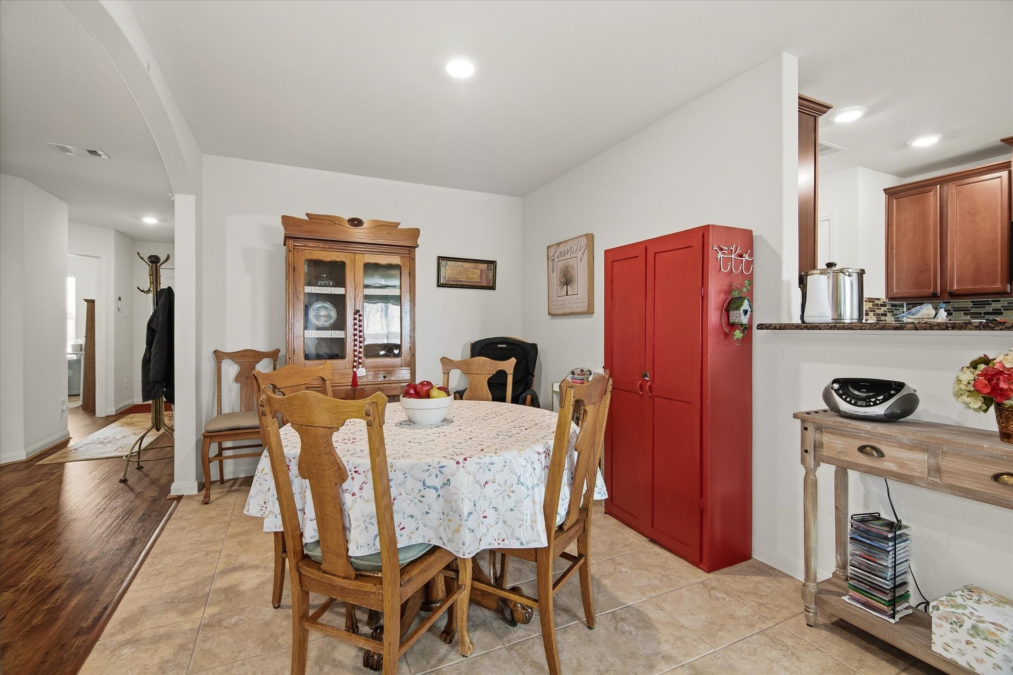 1306 Paradise Found Drive Rosharon, TX 77583 - Photo 12 of 36 a dining room with furniture a window and stainless steel appliances