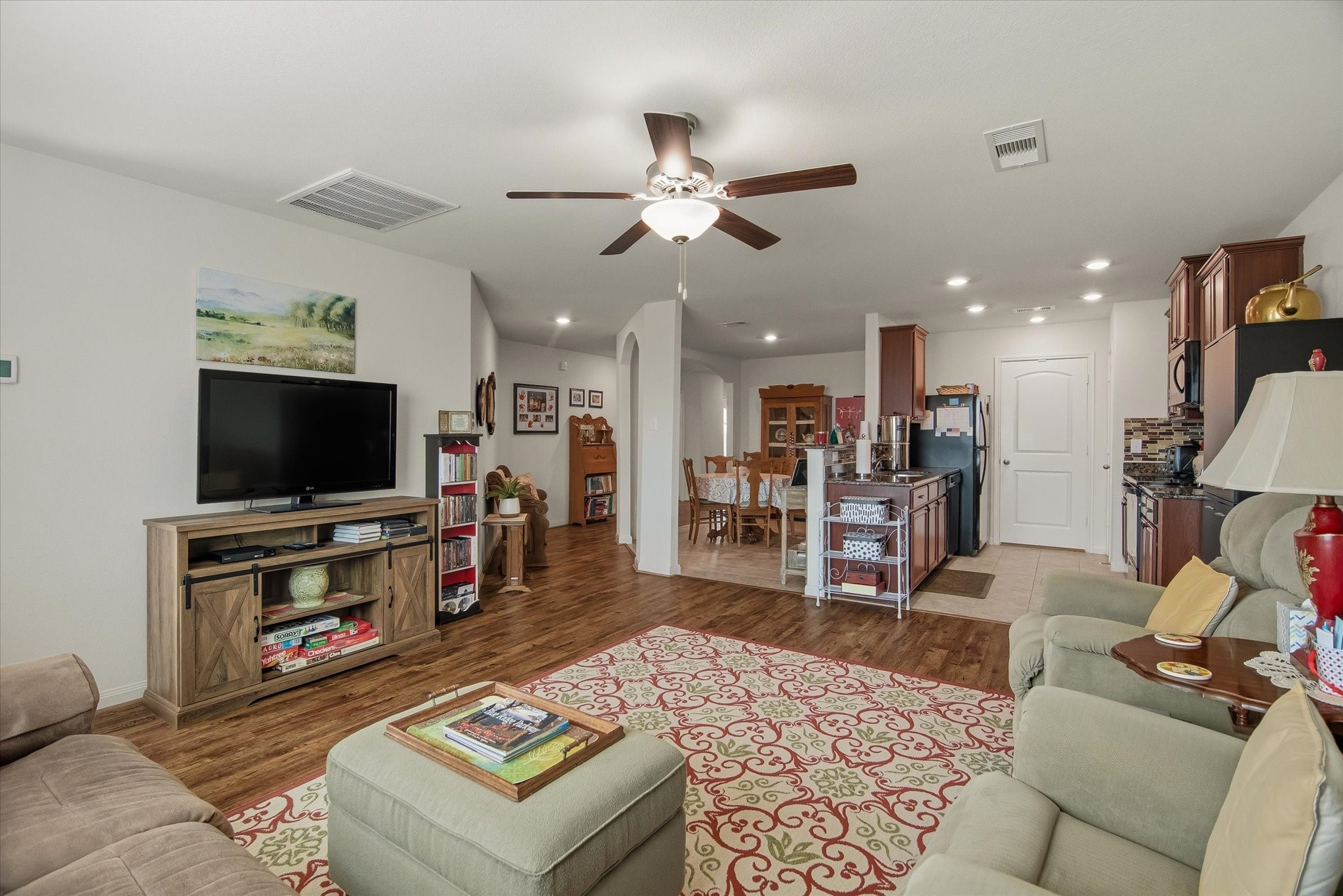 1306 Paradise Found Drive Rosharon, TX 77583 - Photo 16 of 36 a living room with furniture and a flat screen tv