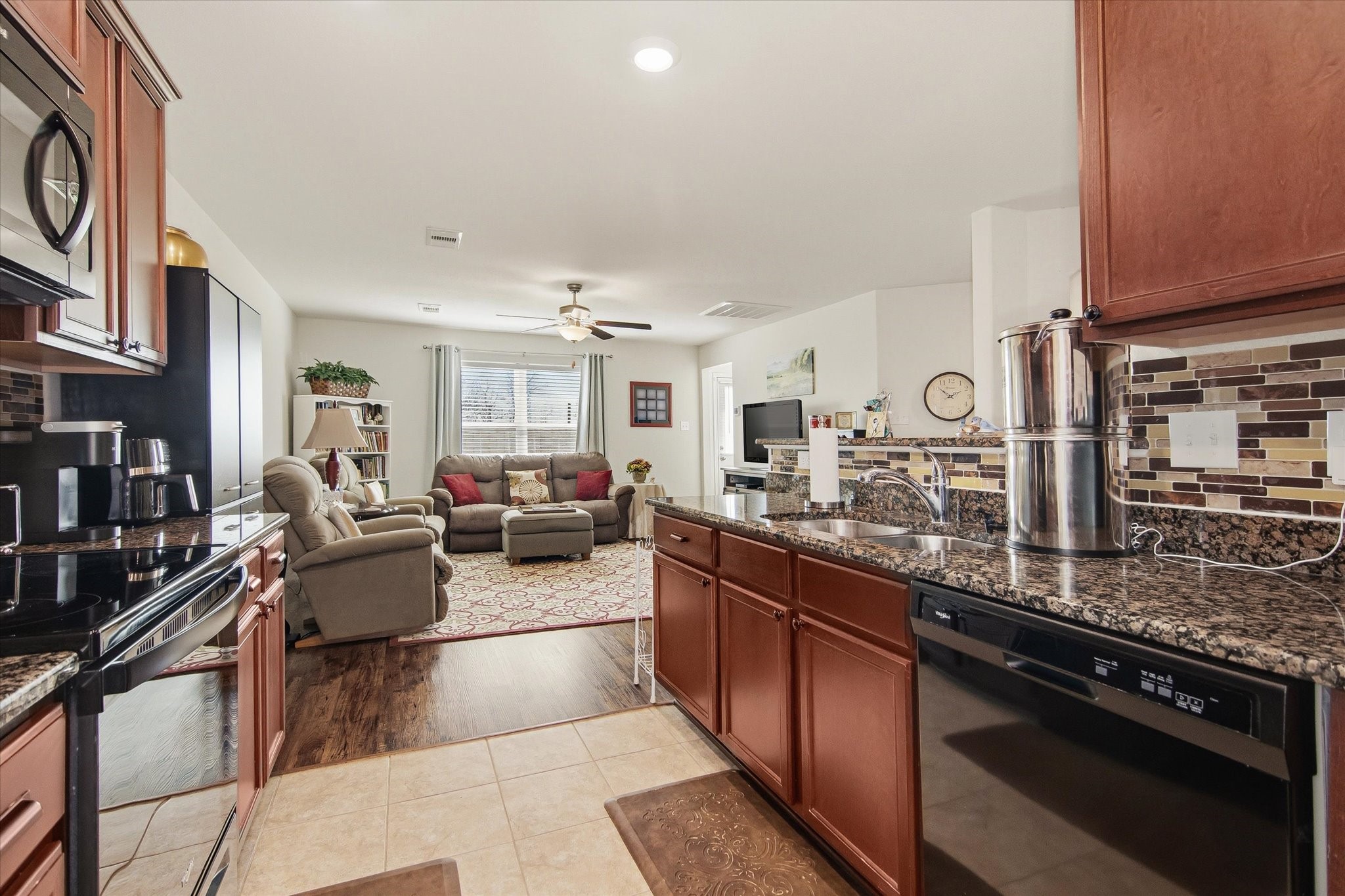 1306 Paradise Found Drive Rosharon, TX 77583 - Photo 20 of 36 a large living room with stainless steel appliances granite countertop lots of counter top space