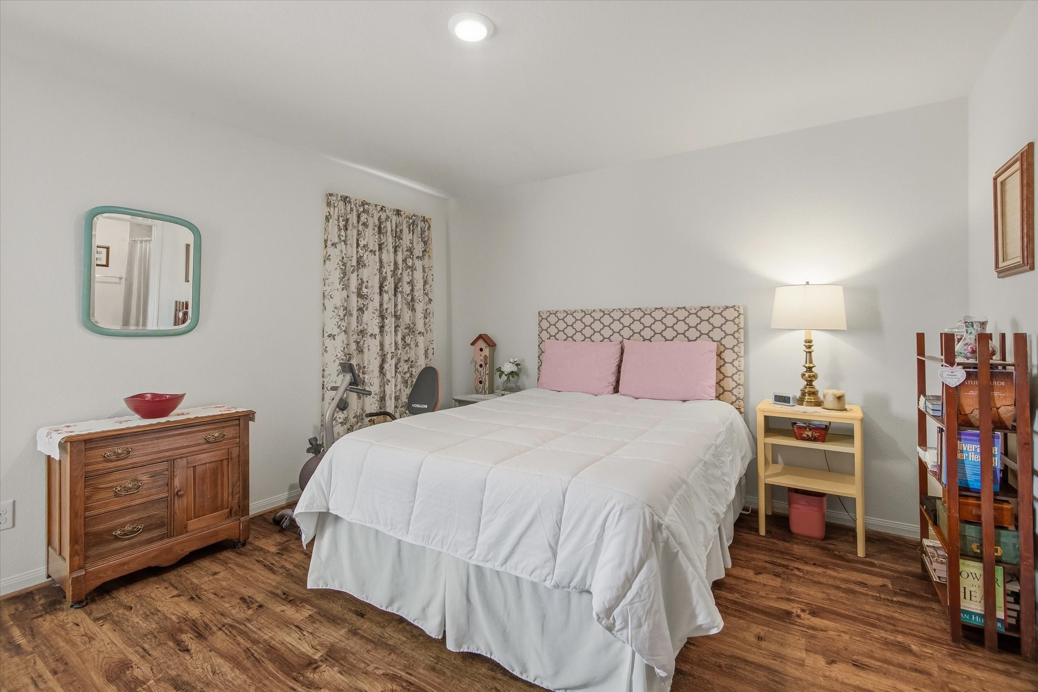 1306 Paradise Found Drive Rosharon, TX 77583 - Photo 23 of 36 a bedroom with a bed and wooden floor