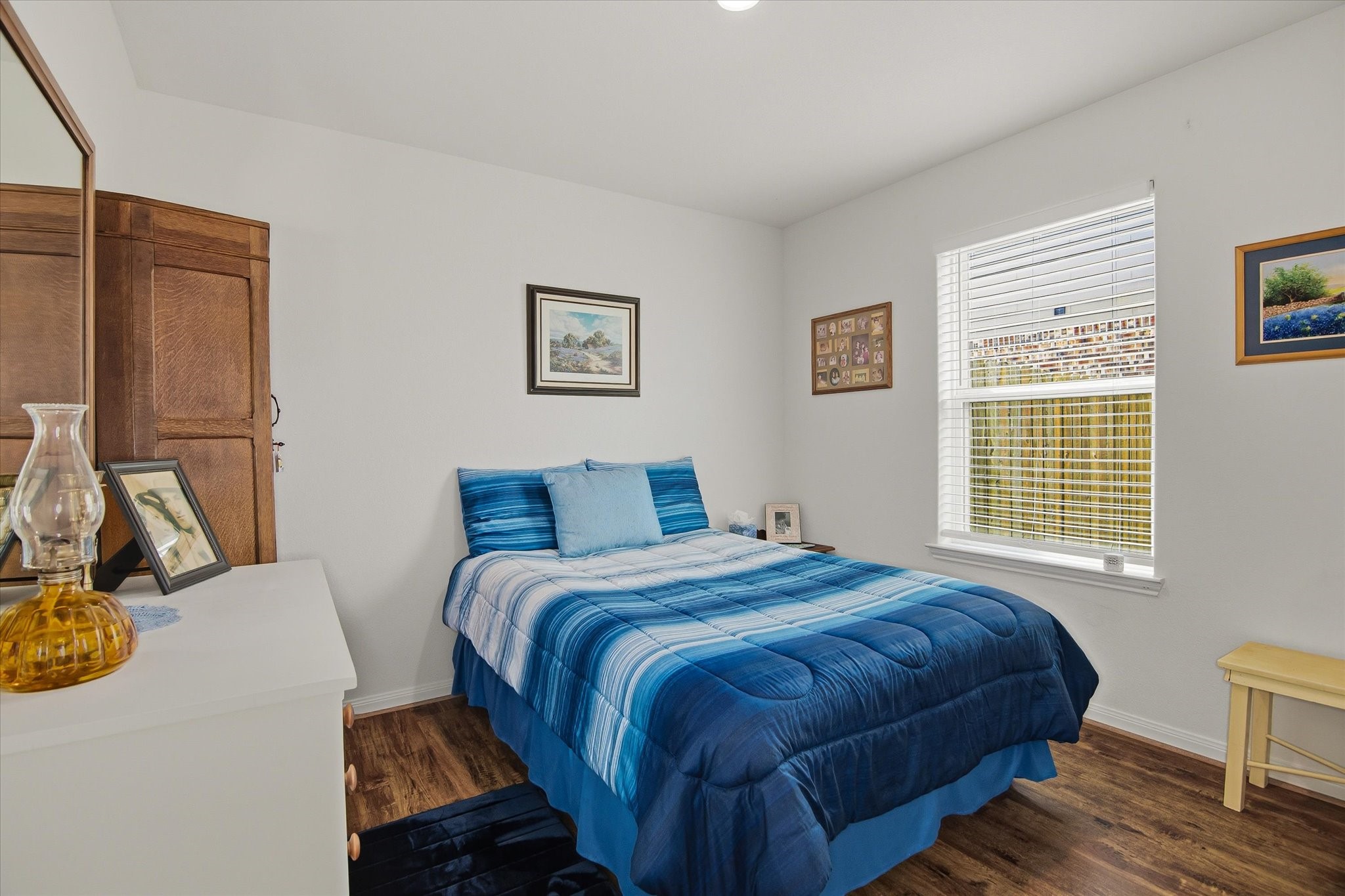 1306 Paradise Found Drive Rosharon, TX 77583 - Photo 5 of 36 a bedroom with a bed and wooden floor