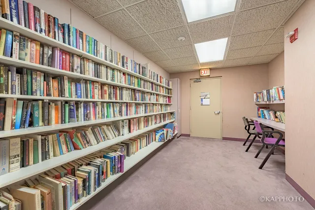 a room with bookshelf and a book shelf