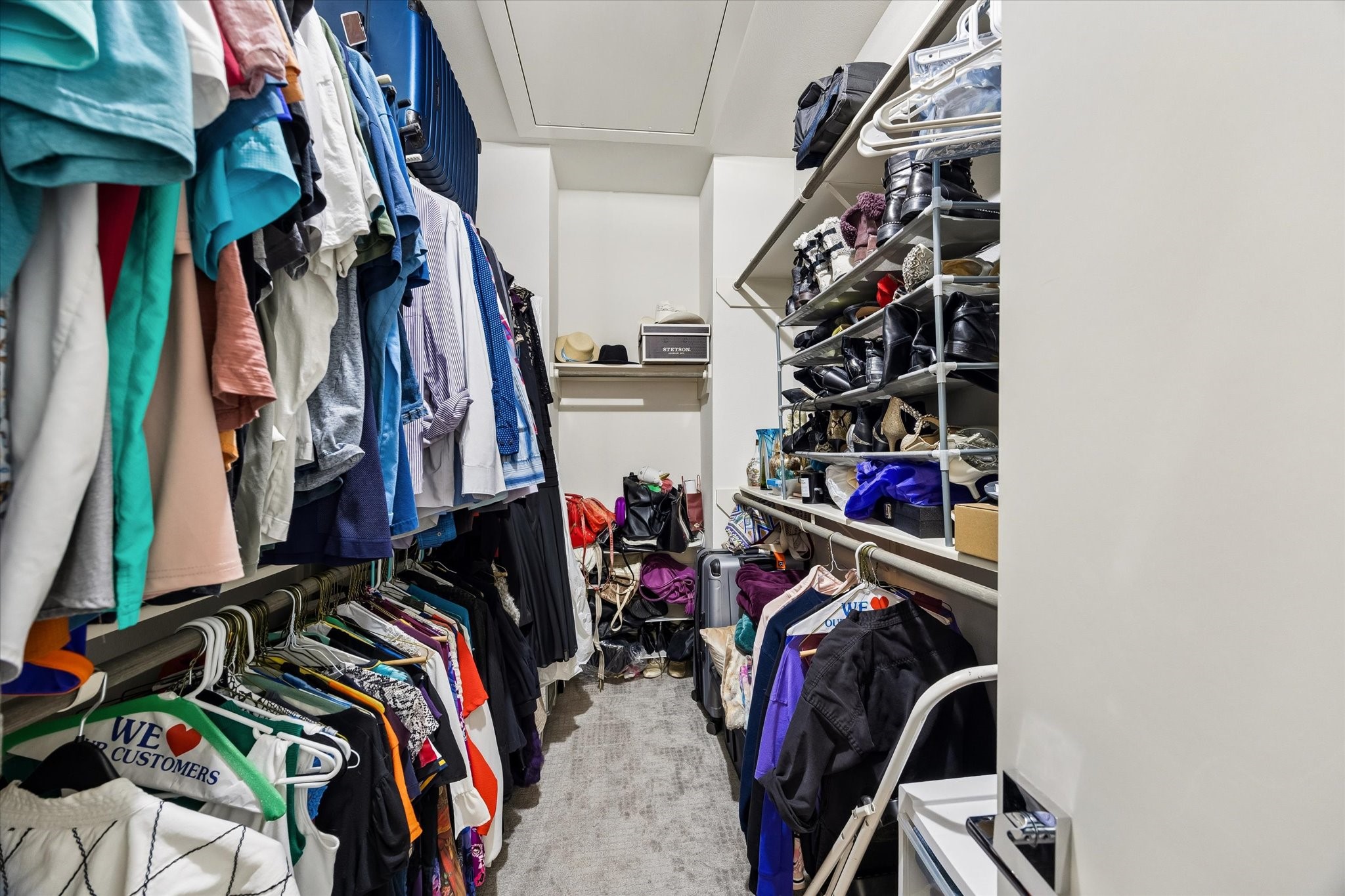 1310 Hussion Street Houston, TX 77003 - Photo 22 of 34 This photo showcases a spacious walk-in closet with ample shelving and hanging space, providing excellent storage for clothing, shoes, and accessories.