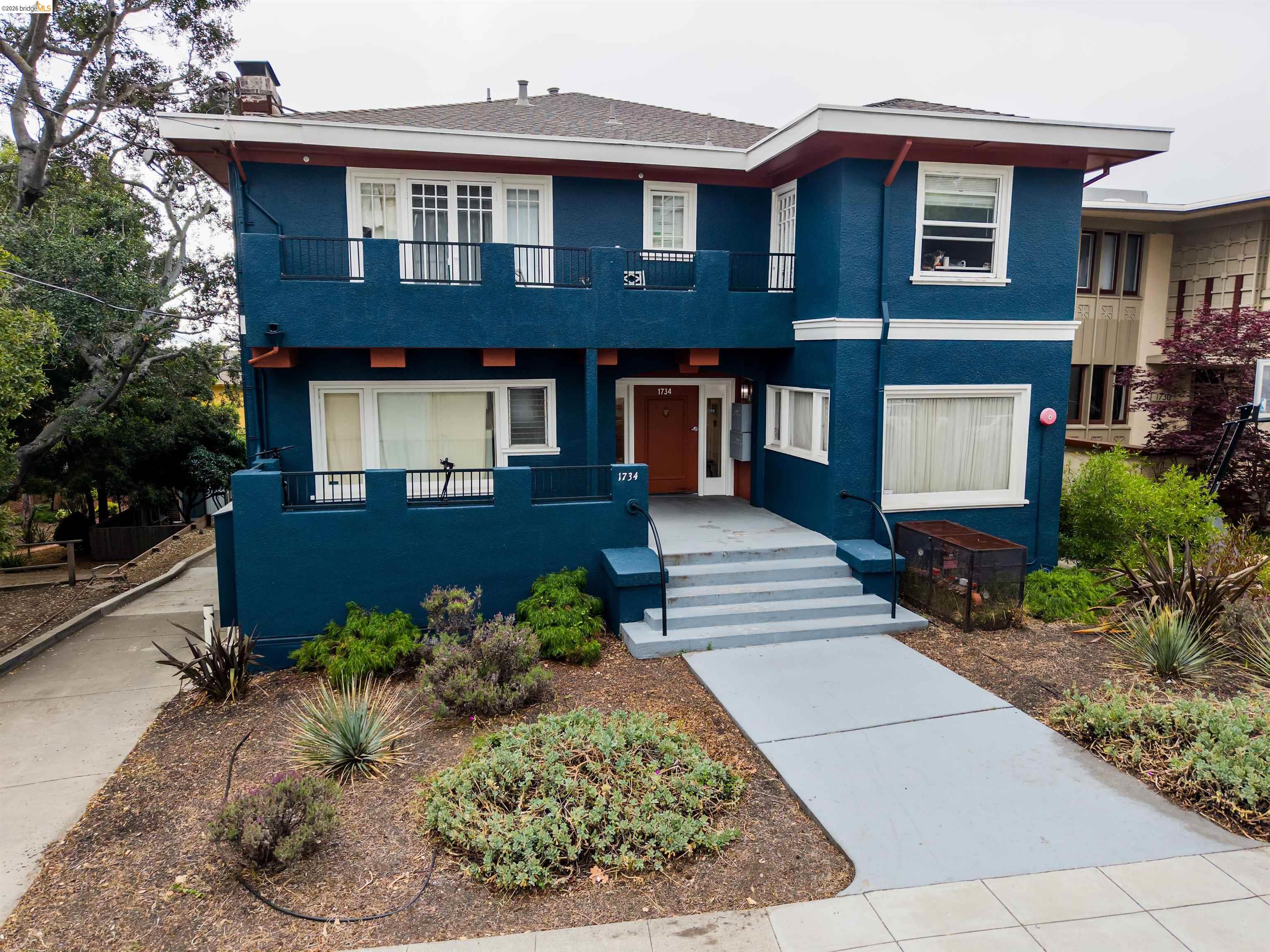 1734 Spruce Street Berkeley, CA 94709 - Photo 2 of 8 a front view of a house with garden