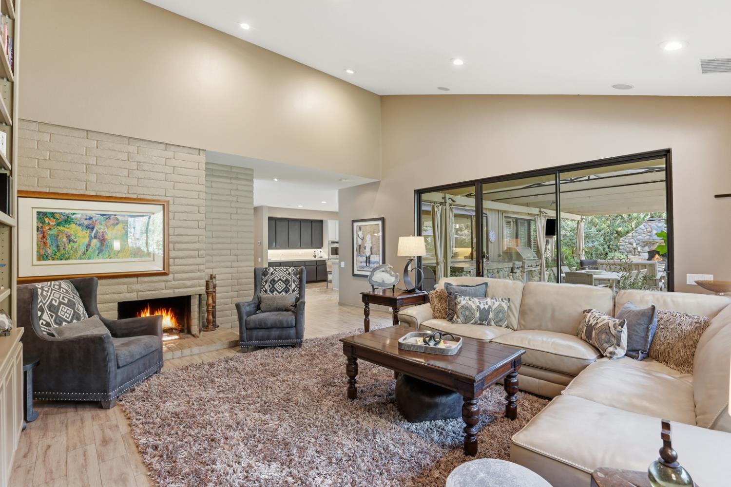 11575 Splitrock Court Gold River, CA 95670 - Photo 28 of 90 a living room with furniture fireplace and a large window
