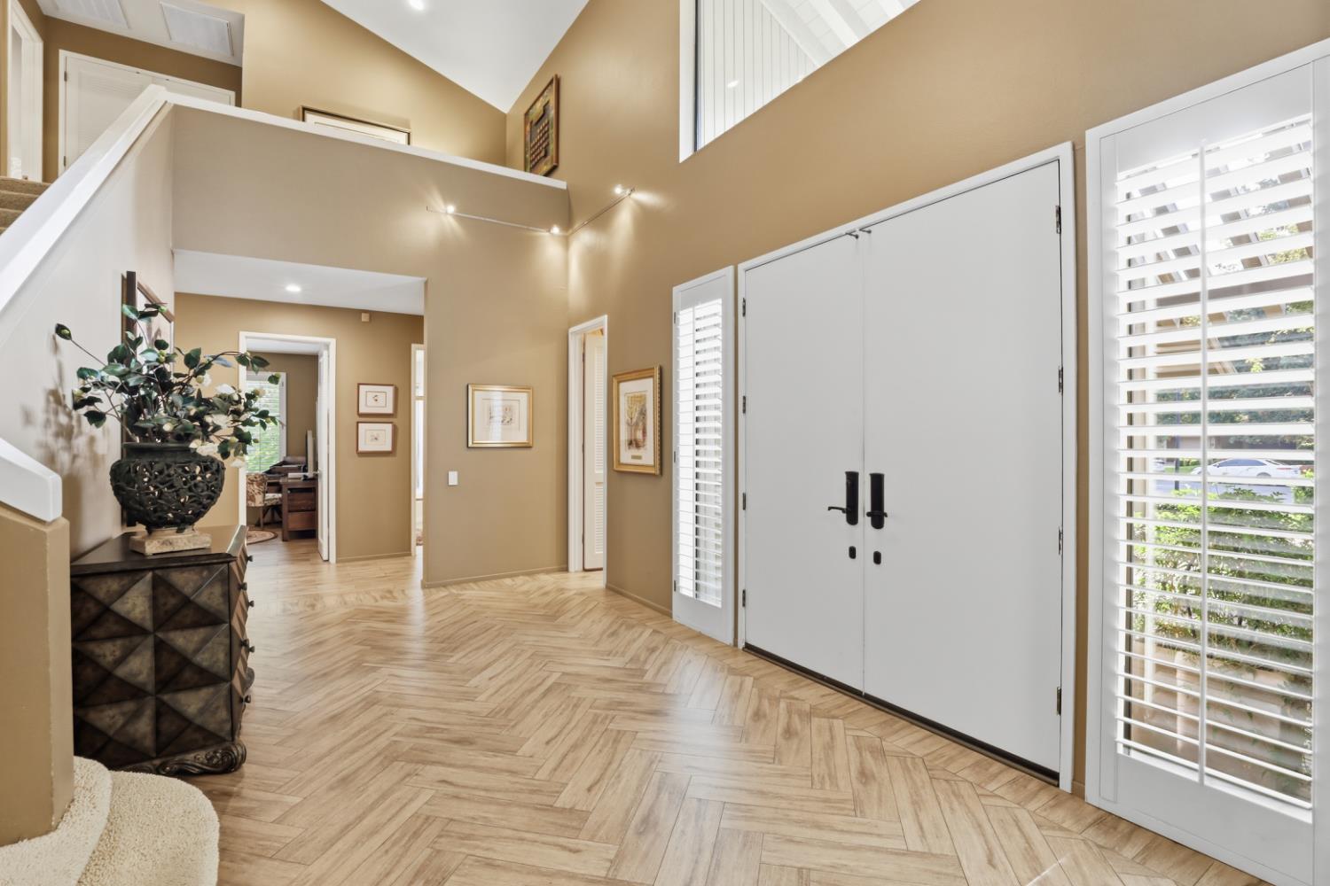 11575 Splitrock Court Gold River, CA 95670 - Photo 5 of 90 a view of a hallway with wooden floor and a living room