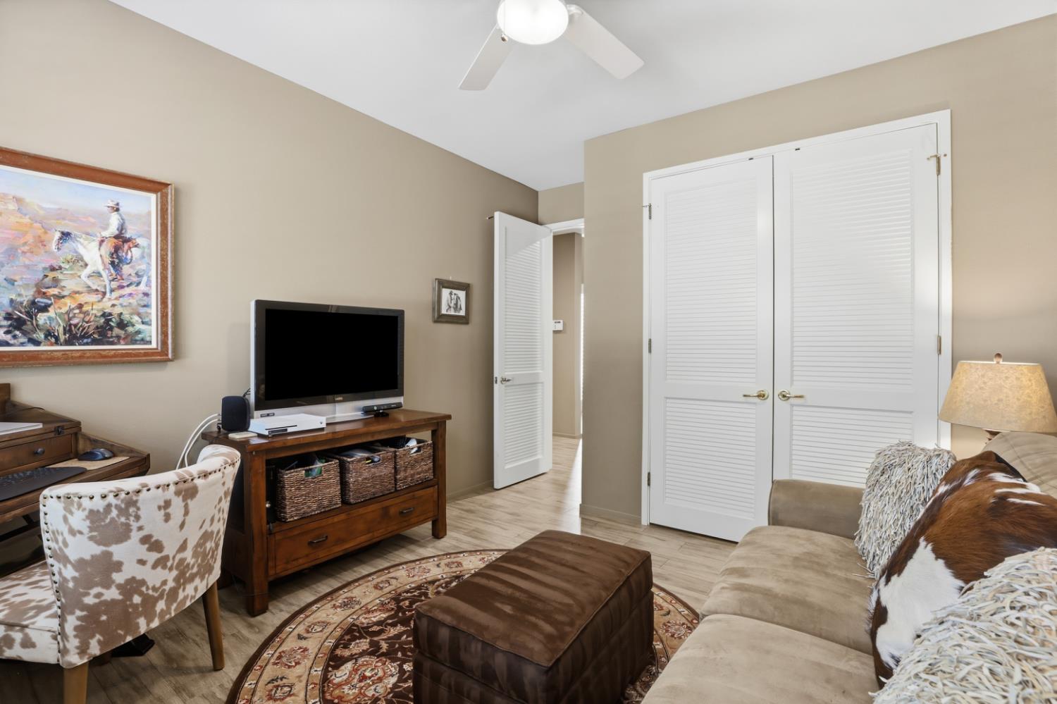 11575 Splitrock Court Gold River, CA 95670 - Photo 55 of 90 a living room with furniture and a flat screen tv