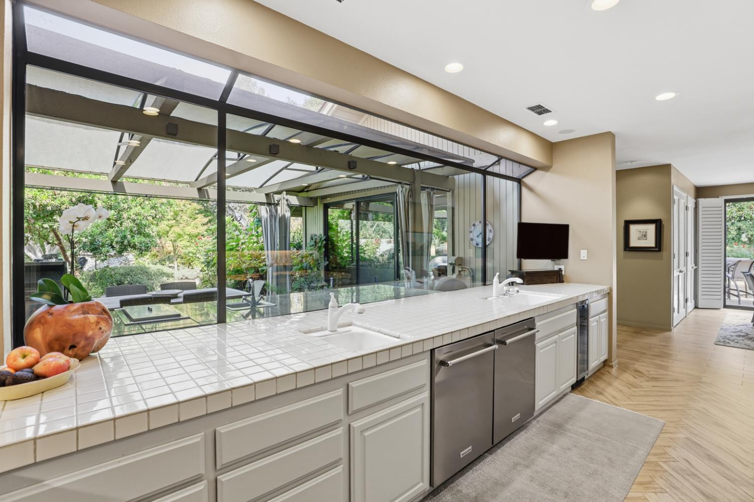 11575 Splitrock Court Gold River, CA 95670 - Photo 8 of 90 a large kitchen with kitchen island a large window in it