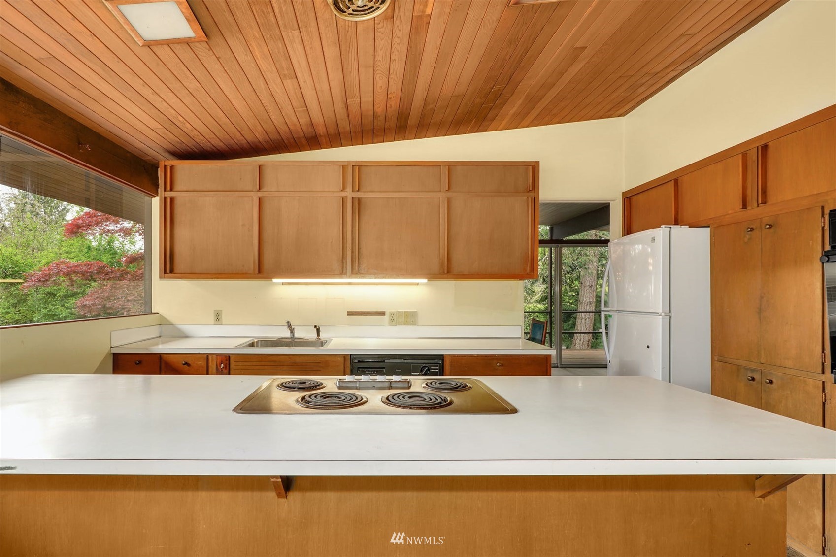 3309 Evergreen Point Road Medina, WA 98039 - Photo 14 of 25 a kitchen with stainless steel appliances granite countertop a sink a stove and a refrigerator