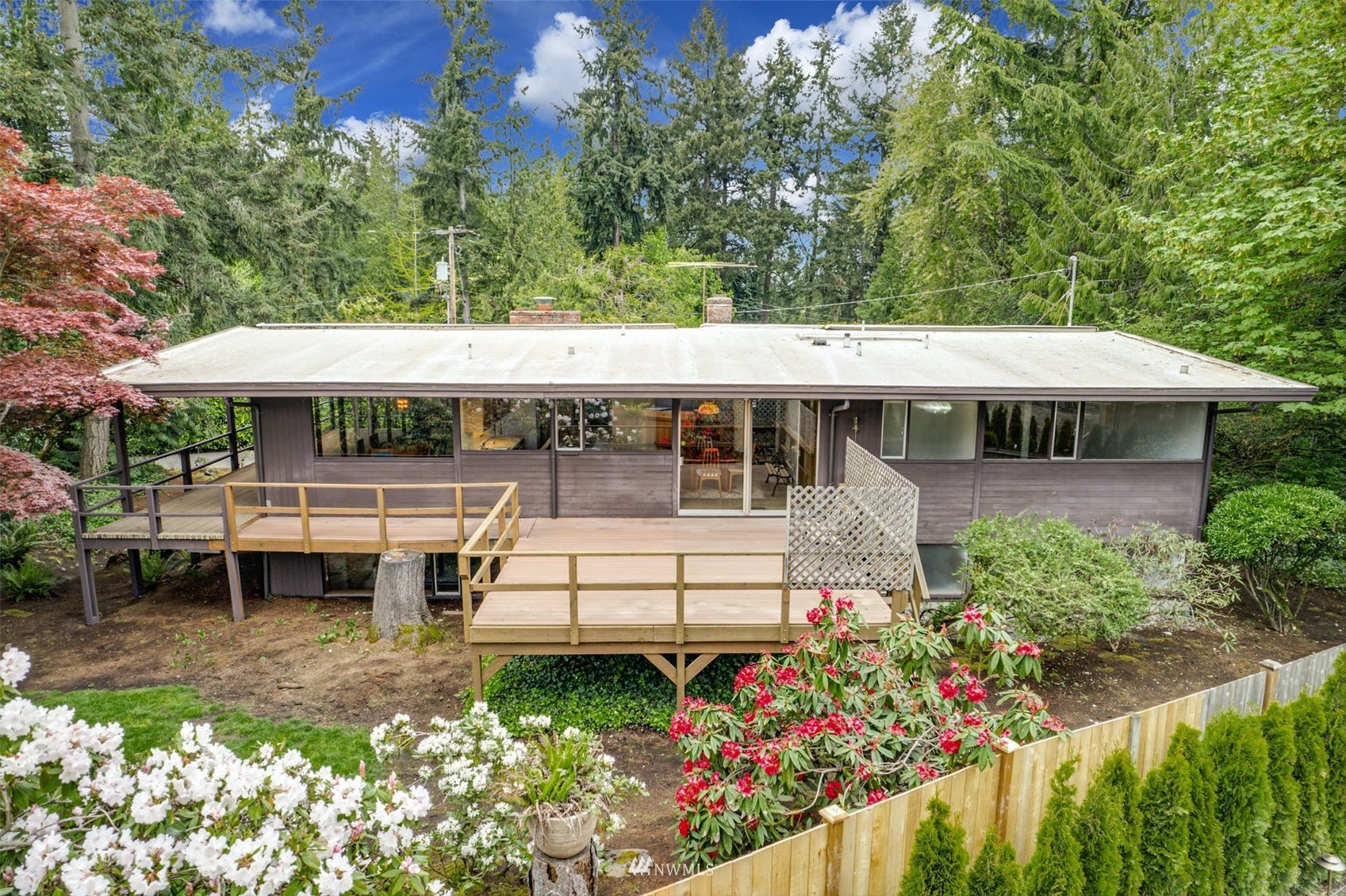 3309 Evergreen Point Road Medina, WA 98039 - Photo 2 of 25 a view of a house with a yard and sitting area