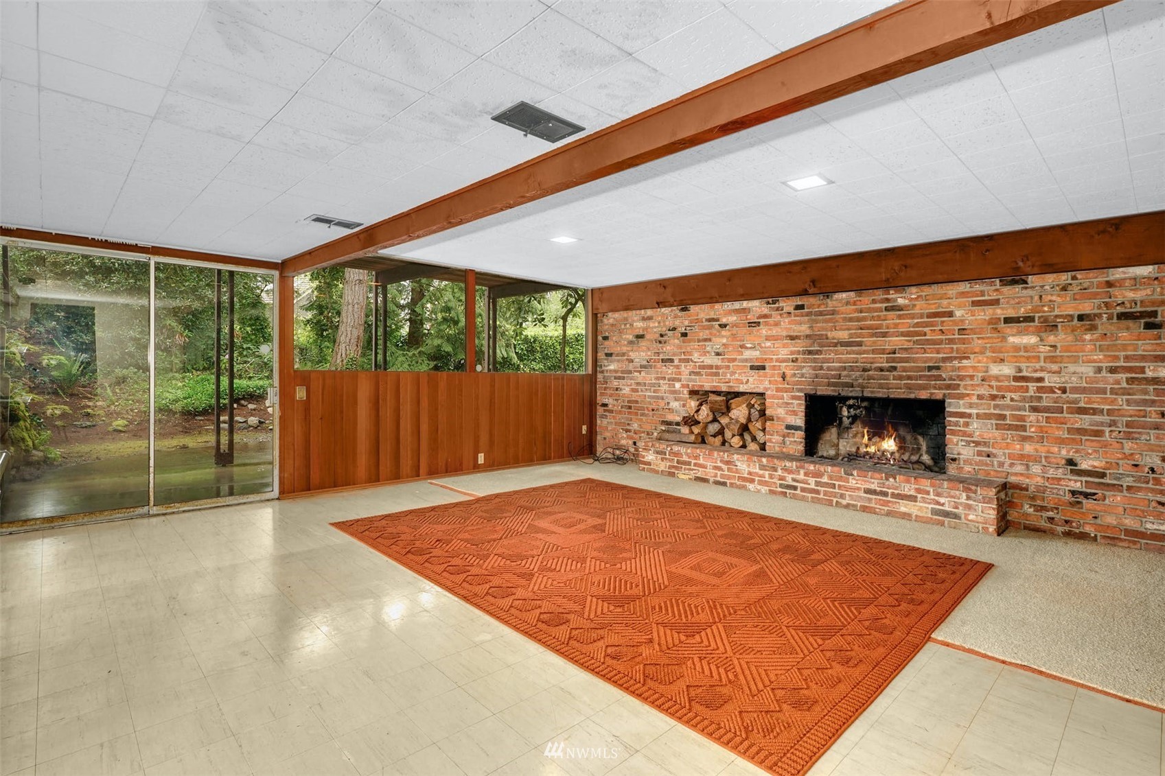 3309 Evergreen Point Road Medina, WA 98039 - Photo 22 of 25 a view of an empty room with a fireplace and a window