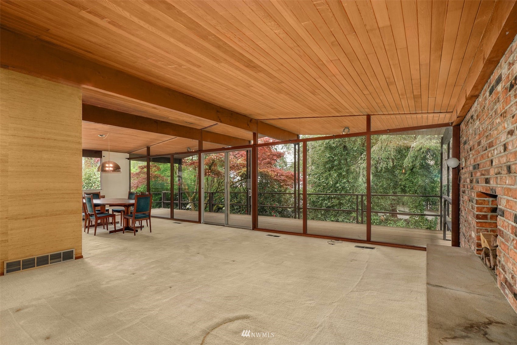 3309 Evergreen Point Road Medina, WA 98039 - Photo 6 of 25 a view of a patio with table and chairs under an umbrella