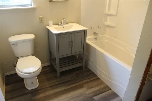 a bathroom with a sink toilet and bathtub
