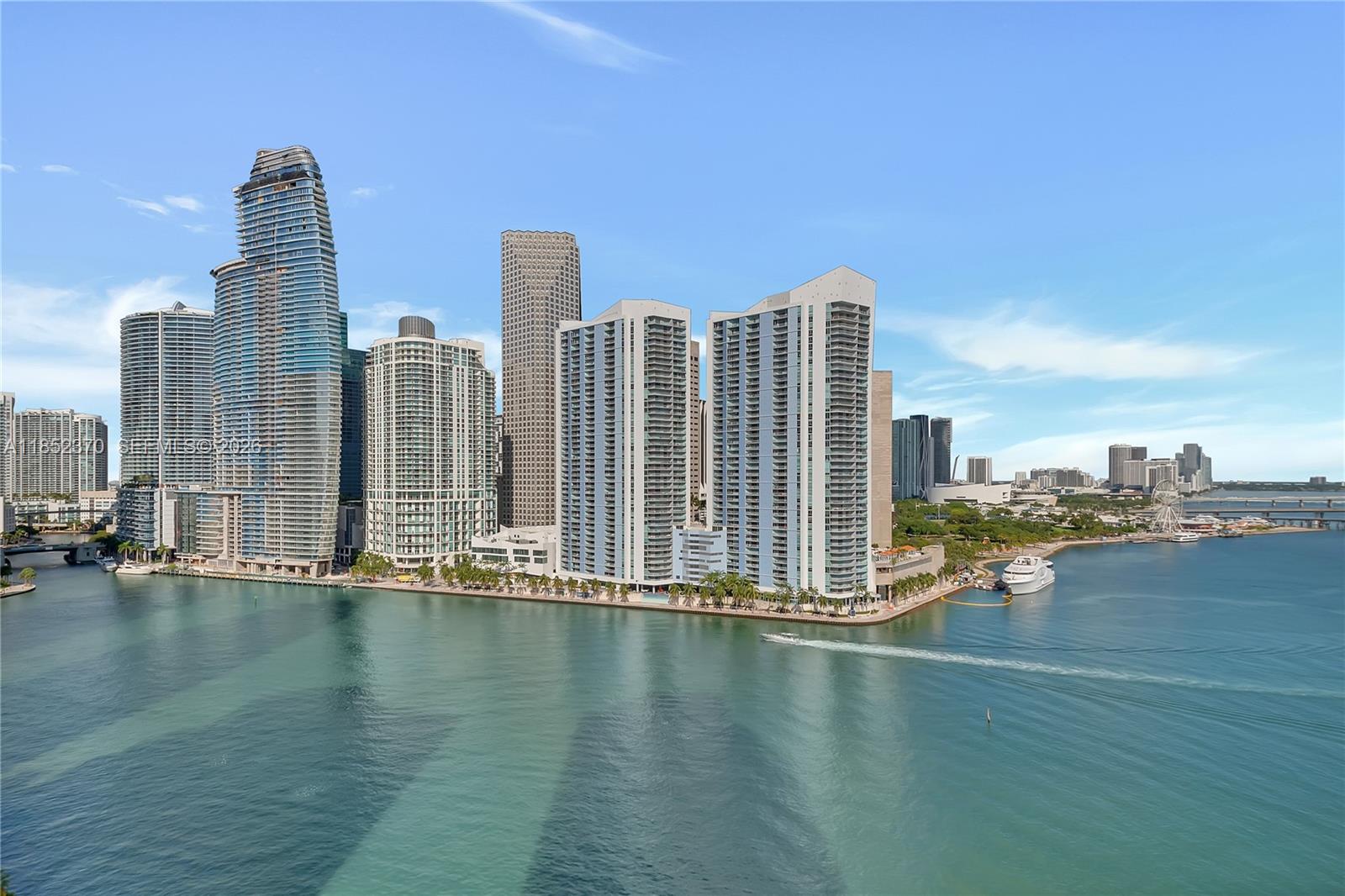 848 Brickell Key Drive, Unit 1906 Miami, FL 33131 - Photo 1 of 24 a view of a city with tall buildings