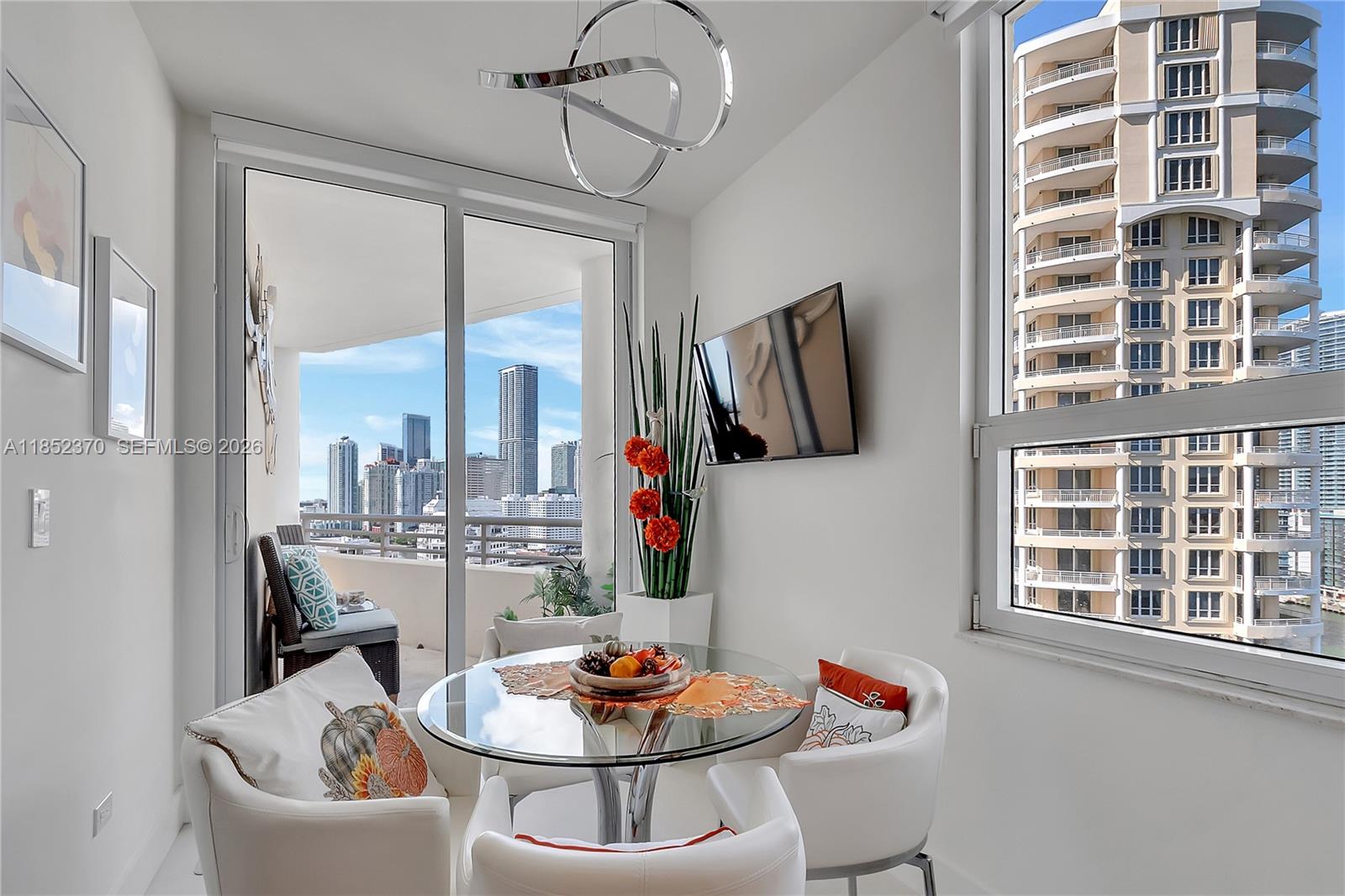848 Brickell Key Drive, Unit 1906 Miami, FL 33131 - Photo 12 of 24 a outdoor dining space with a table and chairs