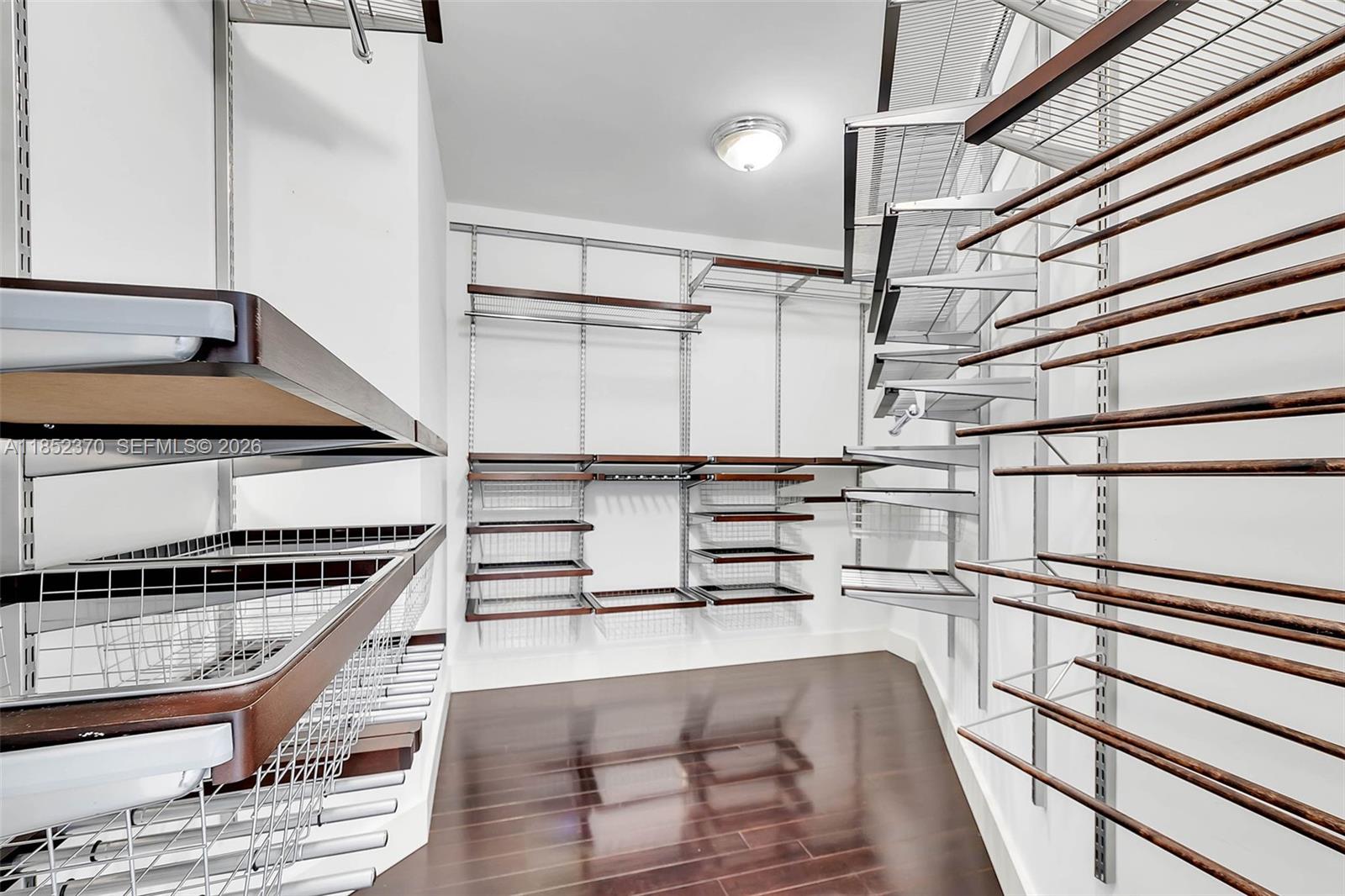 848 Brickell Key Drive, Unit 1906 Miami, FL 33131 - Photo 19 of 24 a view of entryway and hall with wooden floor