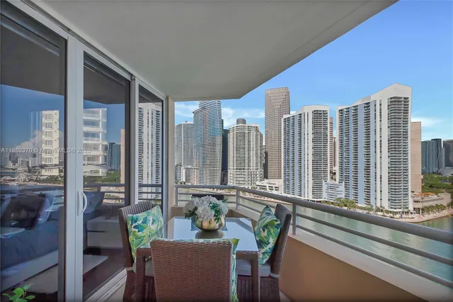 a view of an chairs and table in the balcony