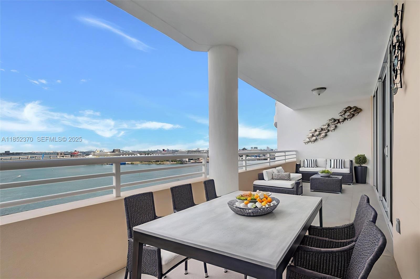 848 Brickell Key Drive, Unit 1906 Miami, FL 33131 - Photo 4 of 18 a view of a dining room with furniture window and outdoor kitchen