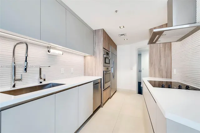 a spacious bathroom with a double vanity sink and mirror