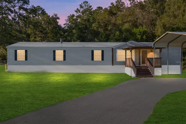 a kitchen with stainless steel appliances a refrigerator sink and cabinets