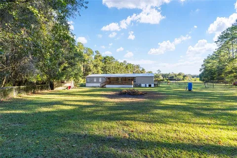 a kitchen with a refrigerator a stove and a sink