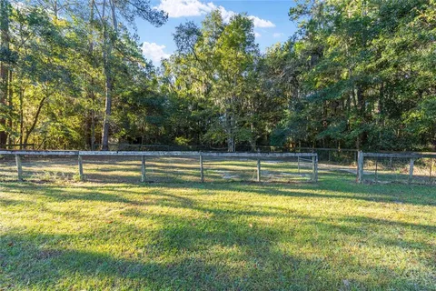 a kitchen with a sink a refrigerator and window